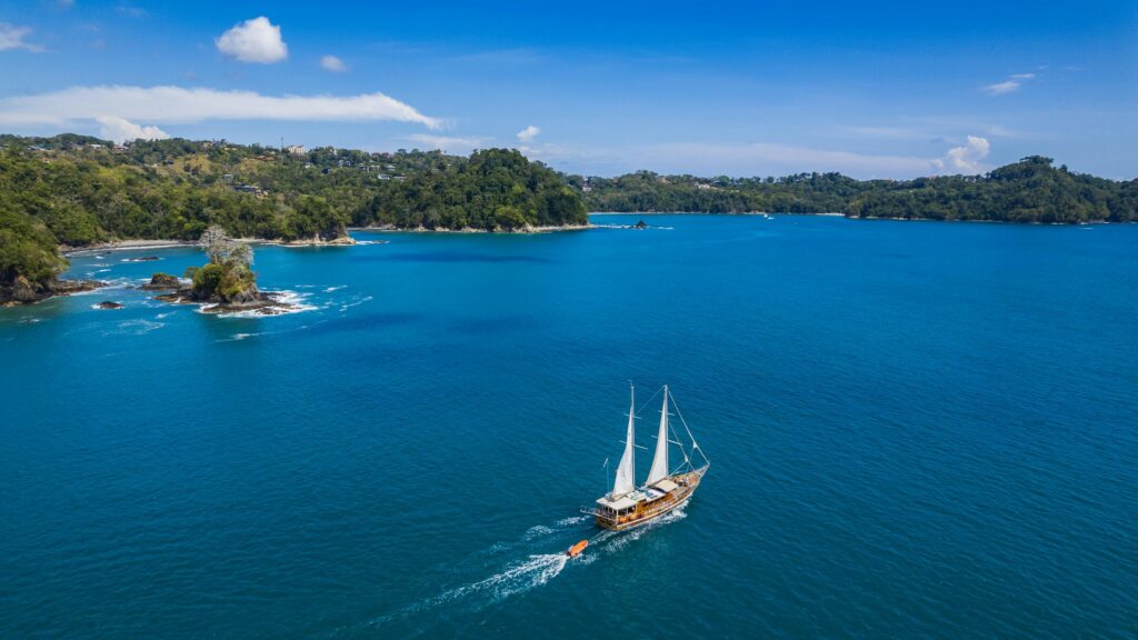 Sailboat cruising in tropical waters.